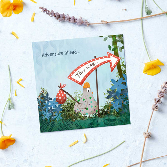 illustration of a chicken with a polka dot bundle and the words adventure ahead