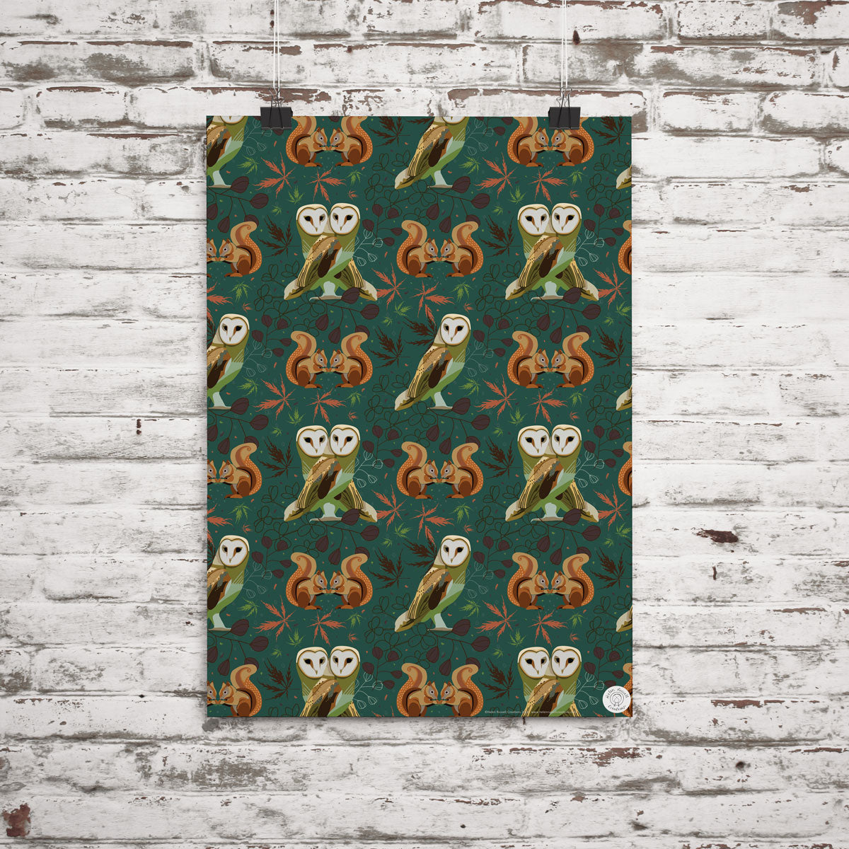 Gift wrap featuring owls, red squirrels and berries