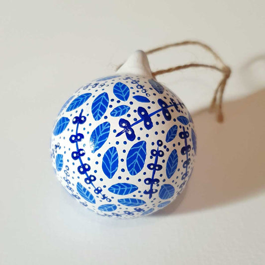 hand painted bauble with blue delft pottery inspired pattern