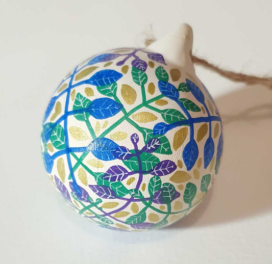 hand painted bauble with intertwined colourful leaves