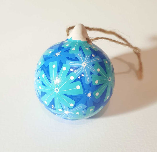 hand painted bauble with lots of blue tone flowers