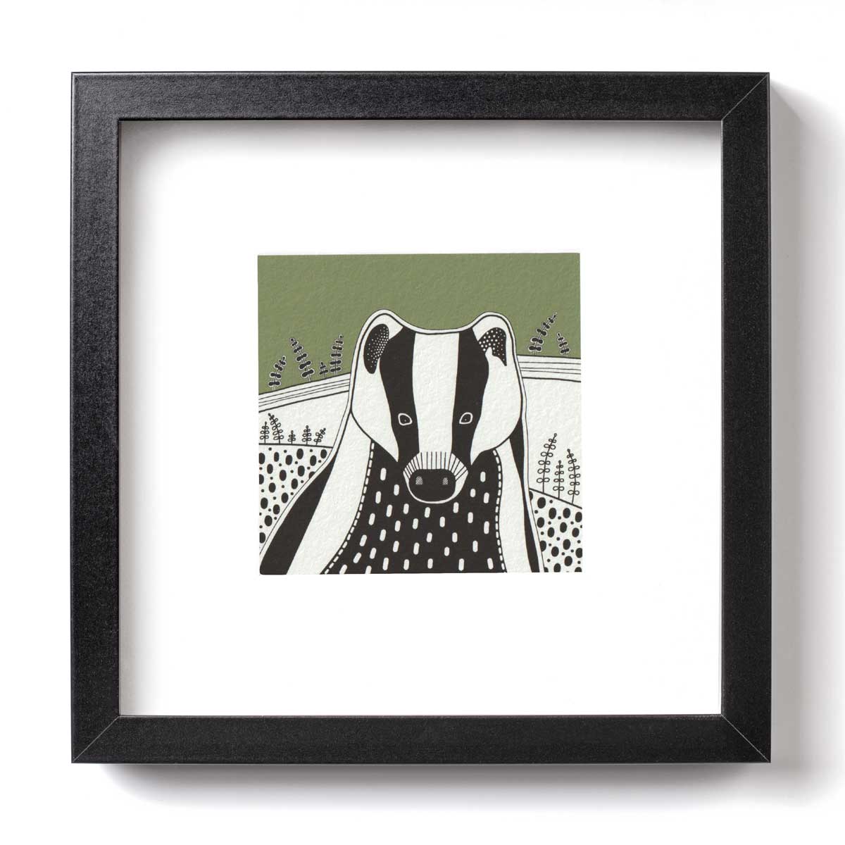 Ink illustration of a badger with a olive green block colour sky
