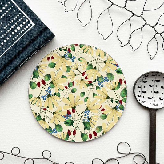 ciecular coaster with white flower and red berry floral pattern