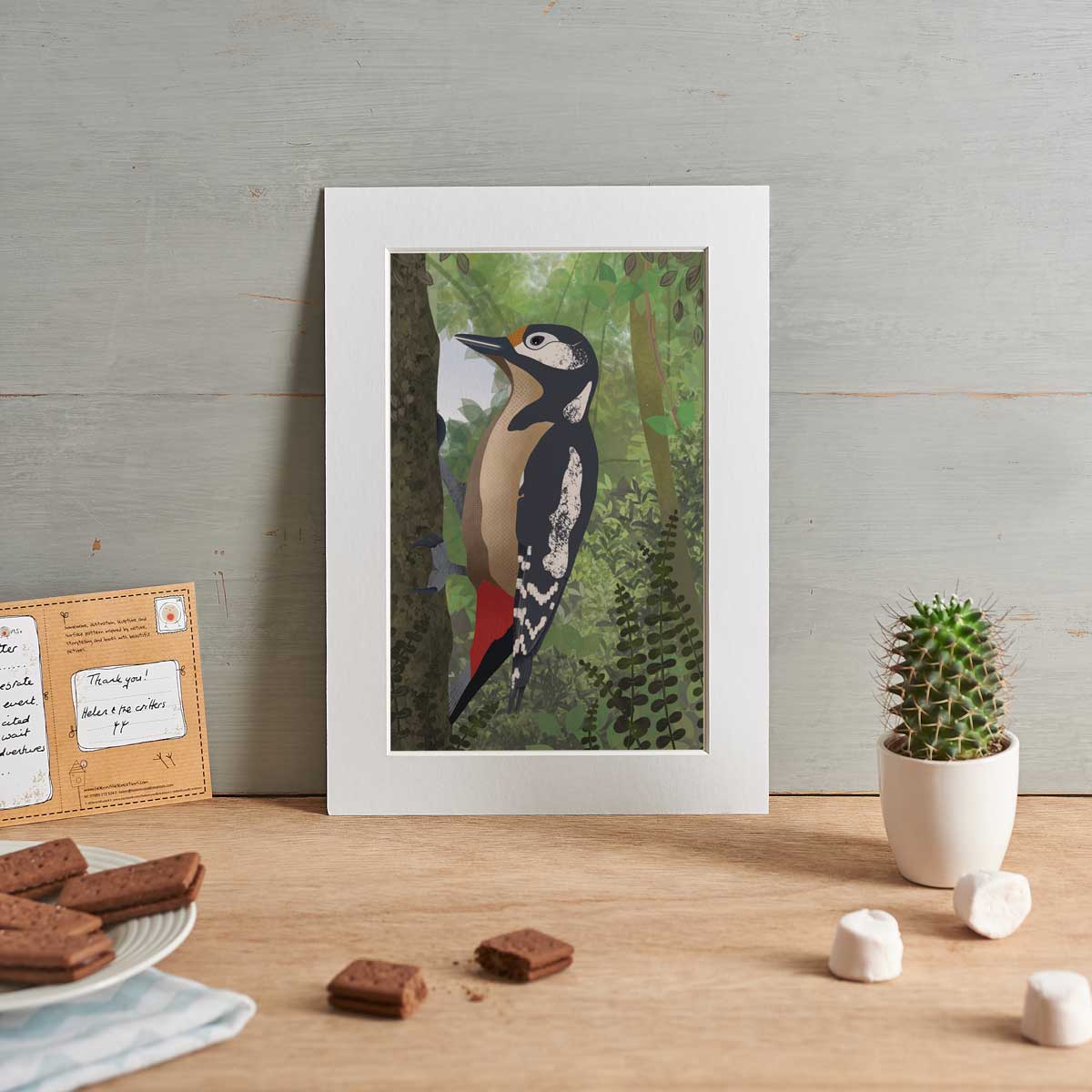 Woodpecker artwork shown in a white picture mount