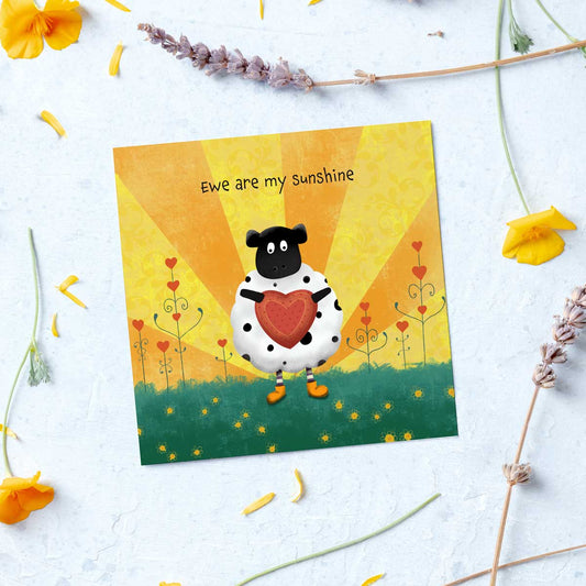 greeting card with sheep holding a heart illustration