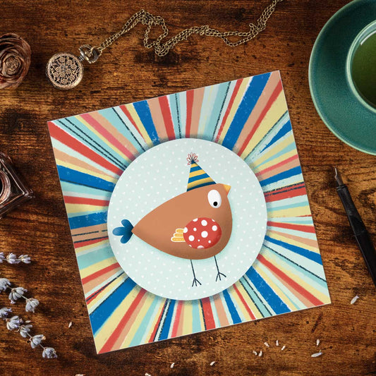 greetings card with birdie illustration in a circle of colourful stripes