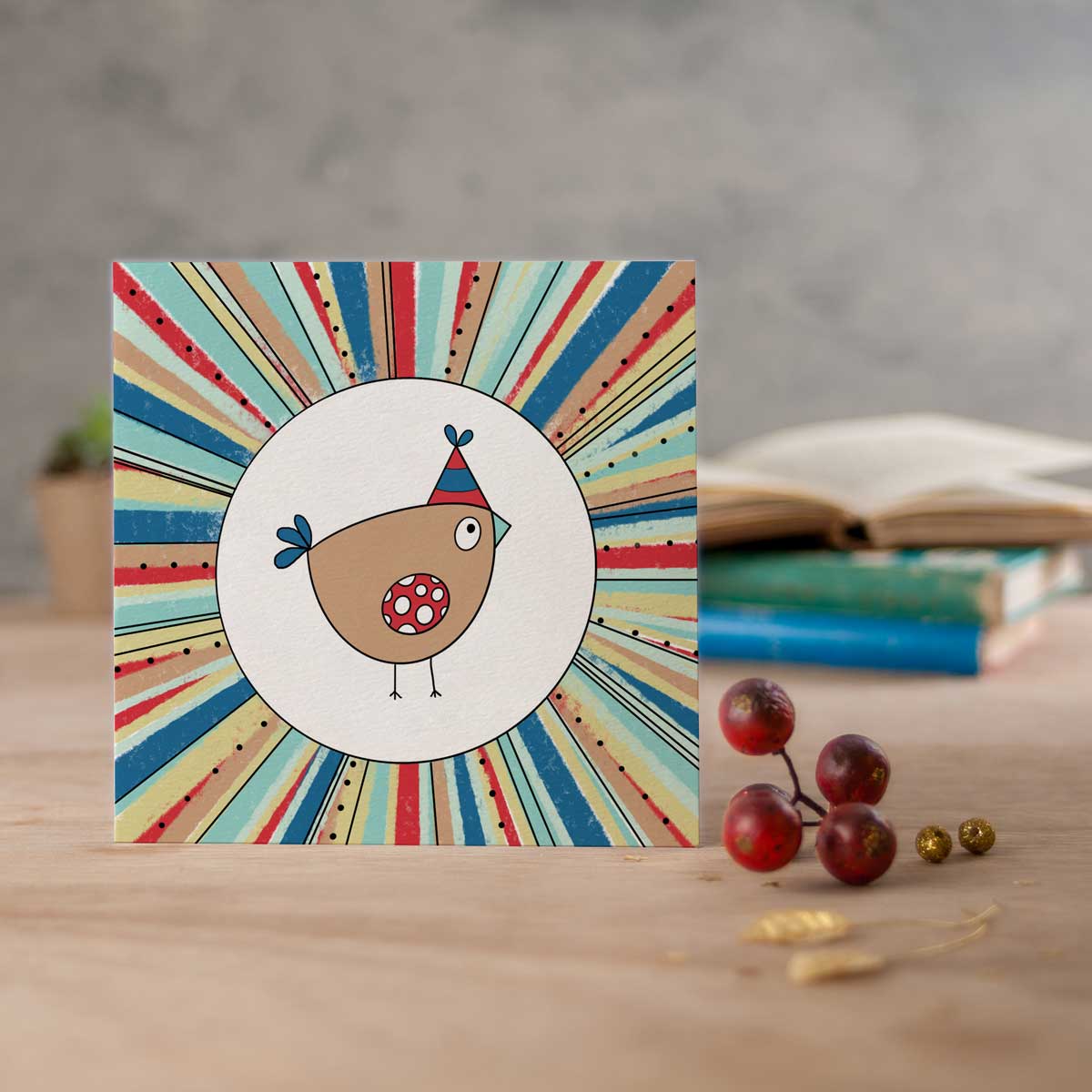 square card with a birdie wearing a party hat in a burst of colours
