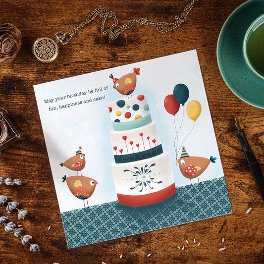greeting card with illustration of birdies, balloons and a giant birthday cake