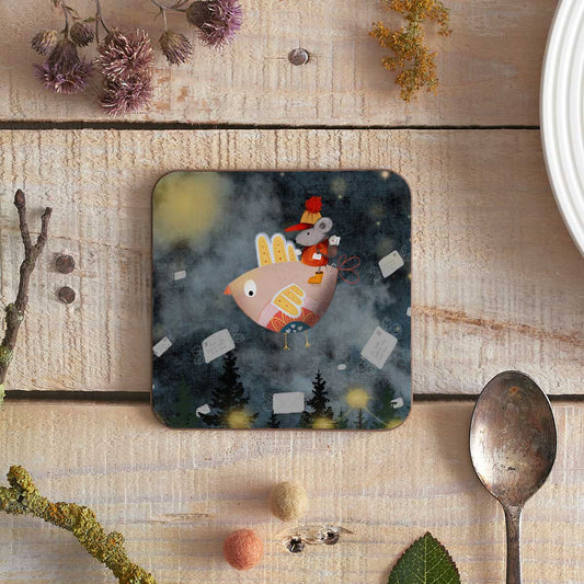 square coaster with an illustration of a birdie with a mouse passenger delivering mail (probably as bonkers as it sounds)