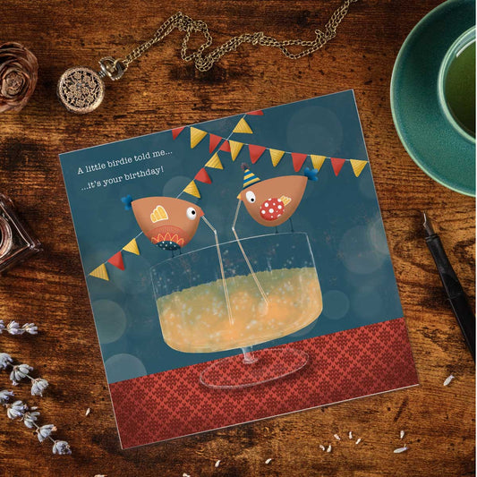 greeting card with illustration of a giant cocktail with two birdies sharing it