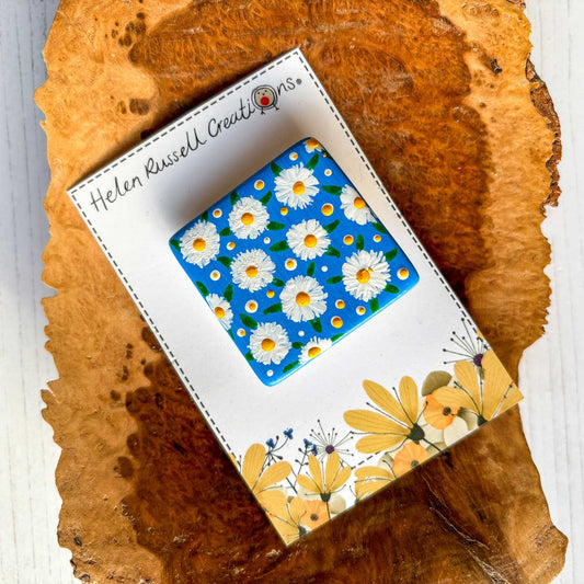 square ceramic brooch handpainted with daisies