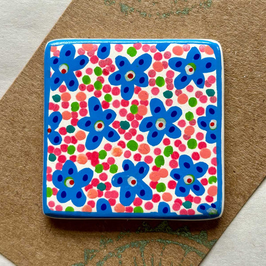 square ceramic brooch with colourful flower and spots design