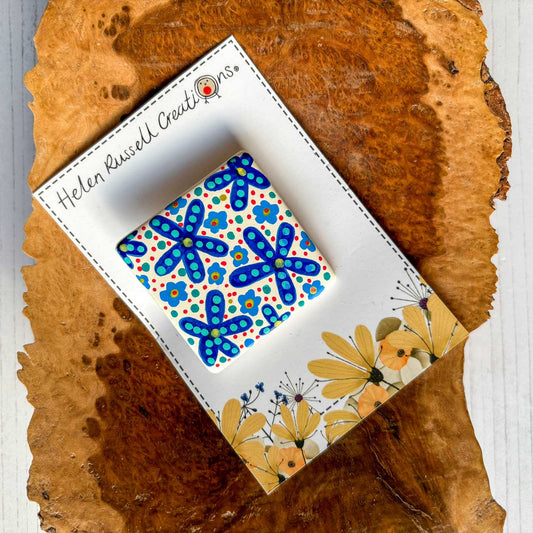 square ceramic brooch handpainted with colourful folk art style floral design