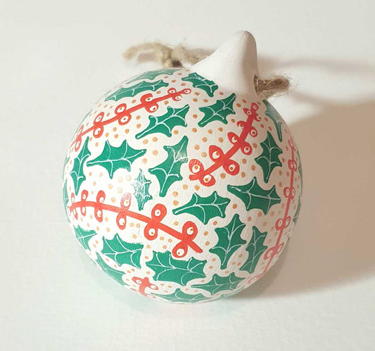 ceramic bauble handpainted with a holly pattern