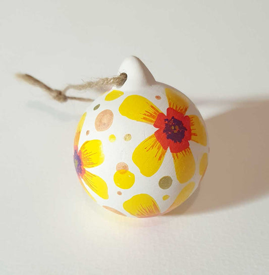 hand painted bauble with colourful flowers and polka dots