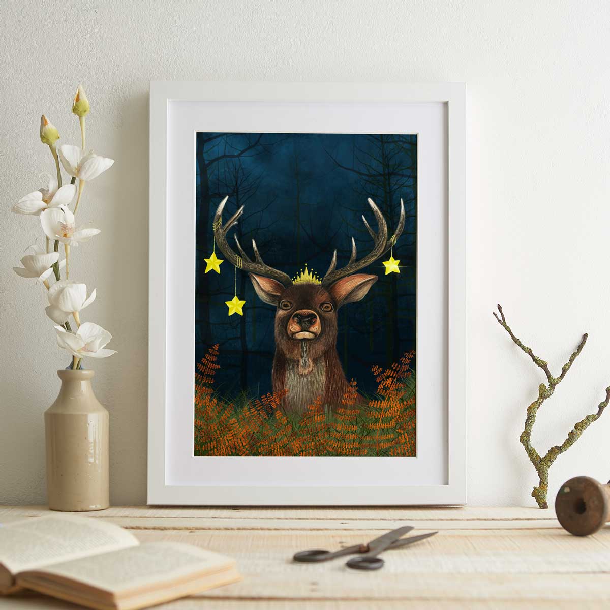 Illustration of a stag wearing a crown and stars