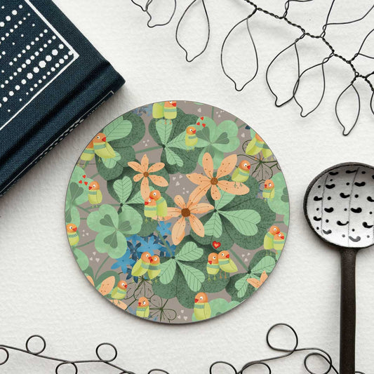 circular coaster with a love birds, leafy pattern
