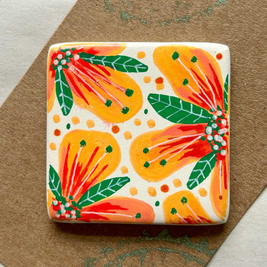 square ceramic brooch with tropical coloured flower illustration