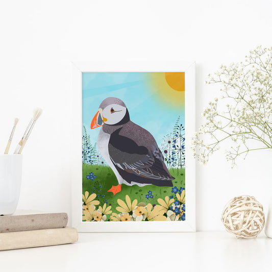 Illustration of a puffin amongst wildflowers 