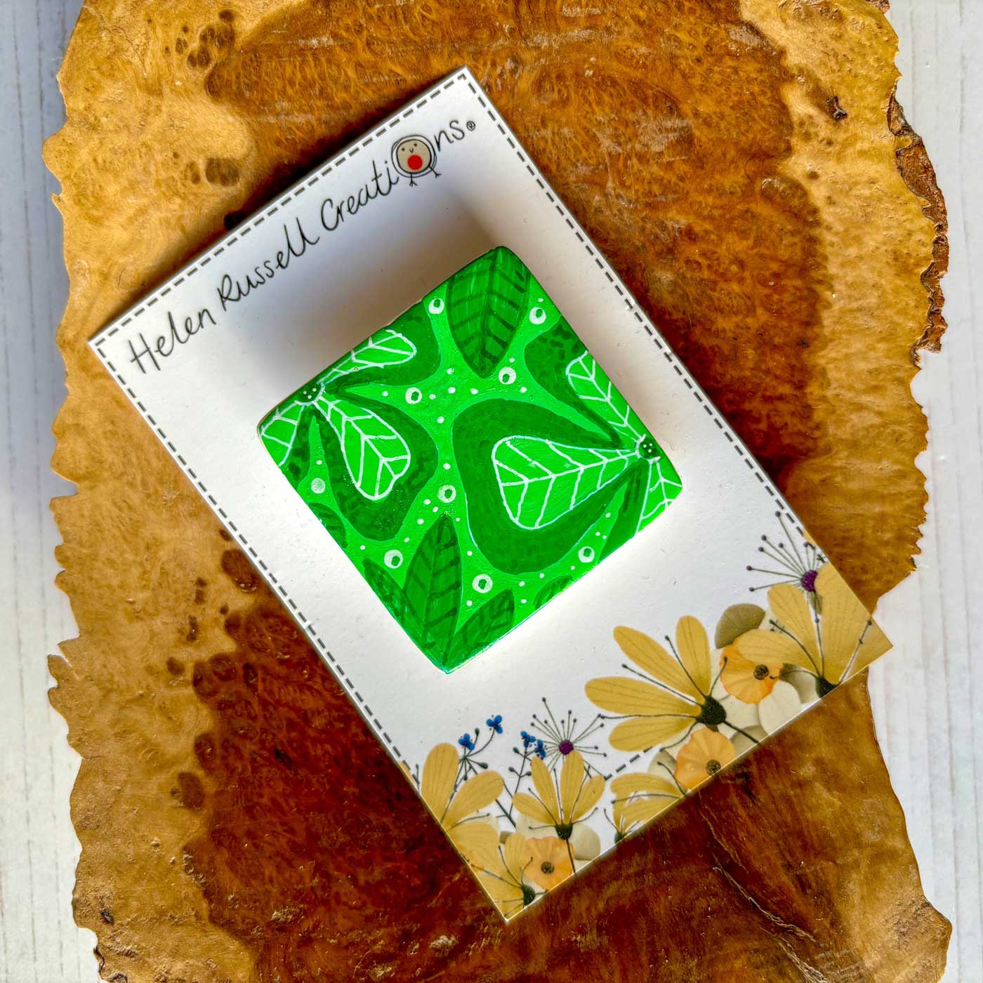 square ceramic brooch handpainted with big tropical leaves