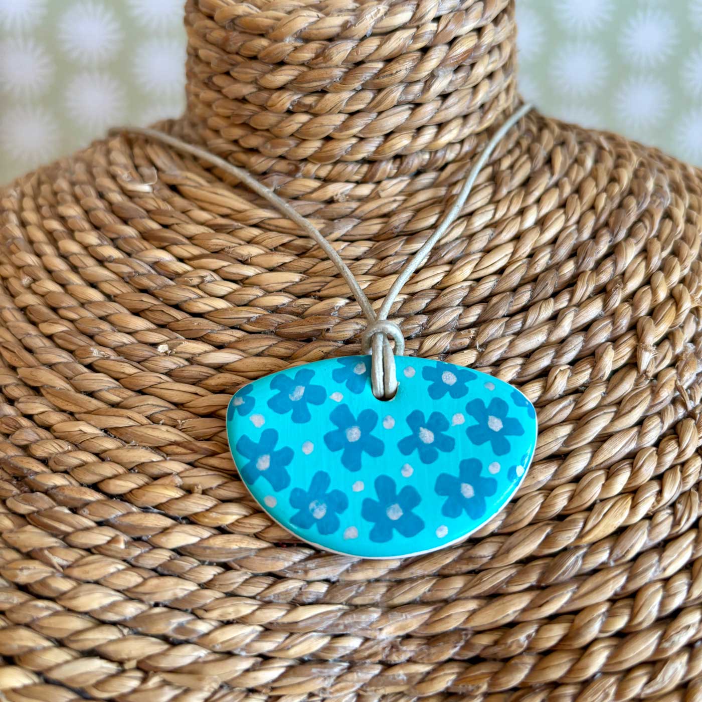 hand painted ceramic pendant with teal floral design