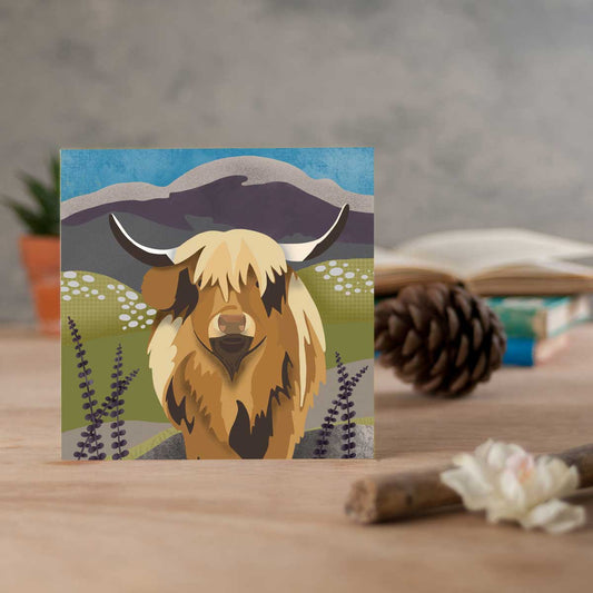 greeting card with a highland cow illustration