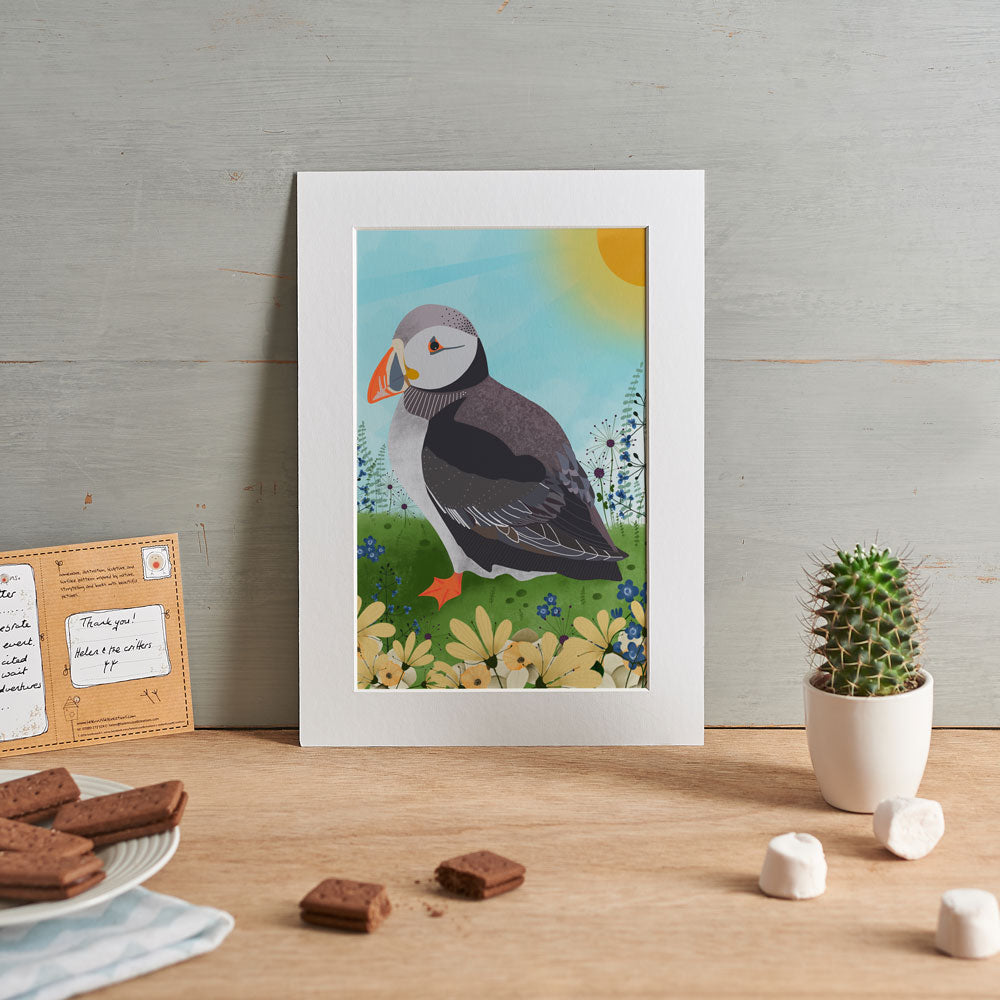 Illustration of a puffin in the sunshine with flowers