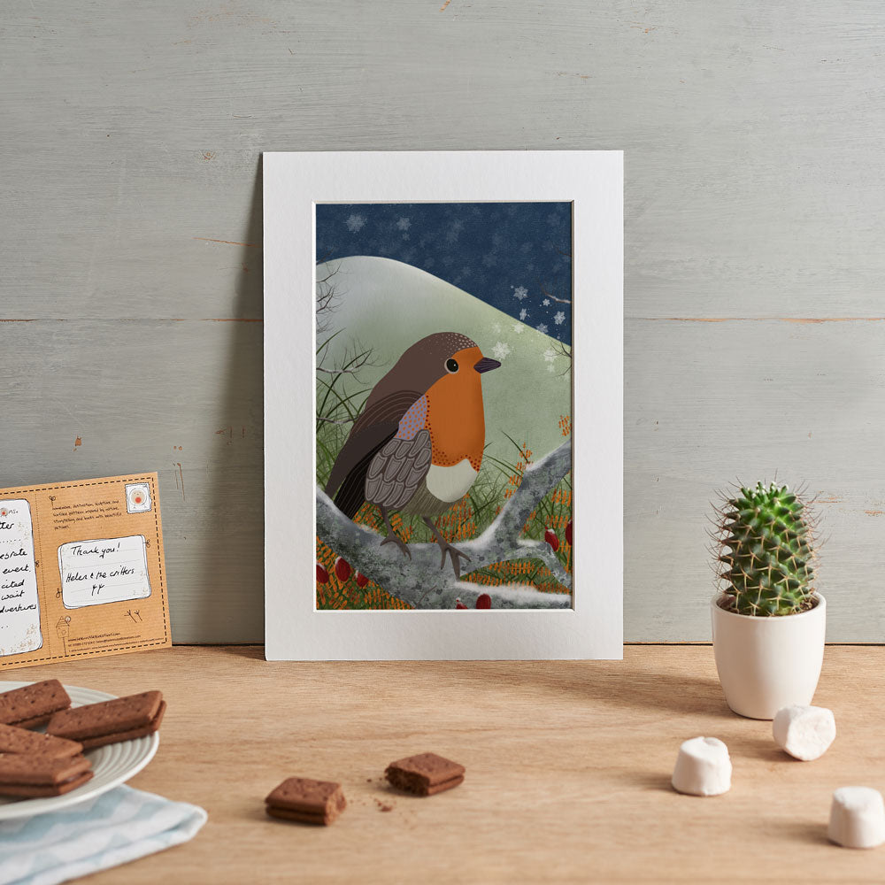 illustration of a robin with a snowflake on it's beak