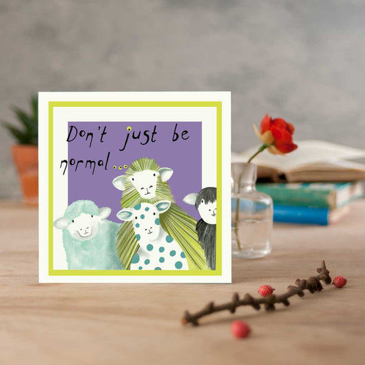 sheep inspired greetings card with the text don't just be normal