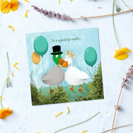 wedding card featuring a pair of ducks getting ready for a wedding ceremony